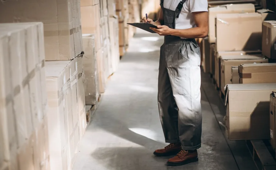 men-warehouse-interior-rows-pallets-boxes.jpg